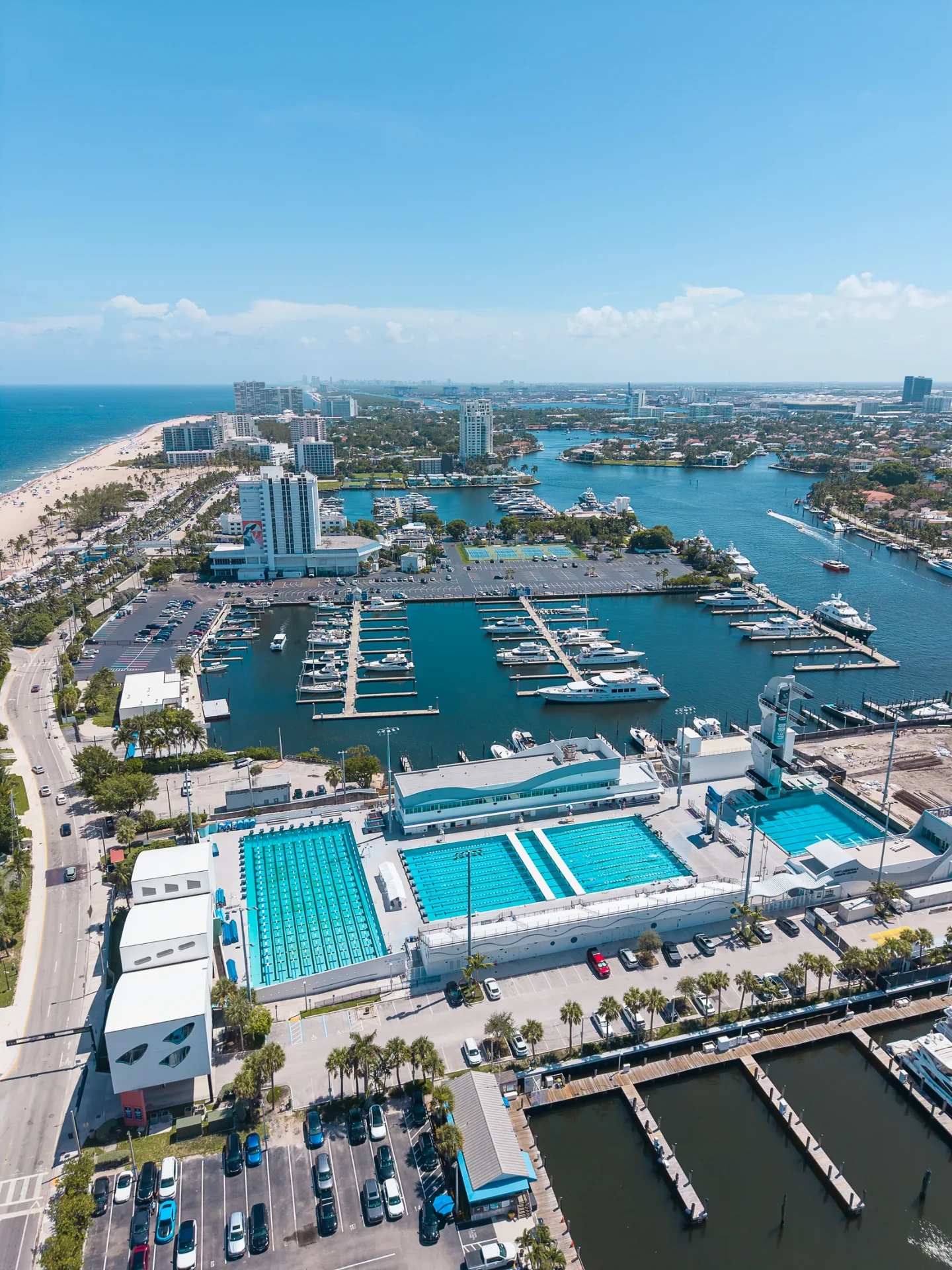 Aerial drone photo of the Fort Lauderdale marina and aquatic center lined with luxury yachts along the Intracoastal Waterway