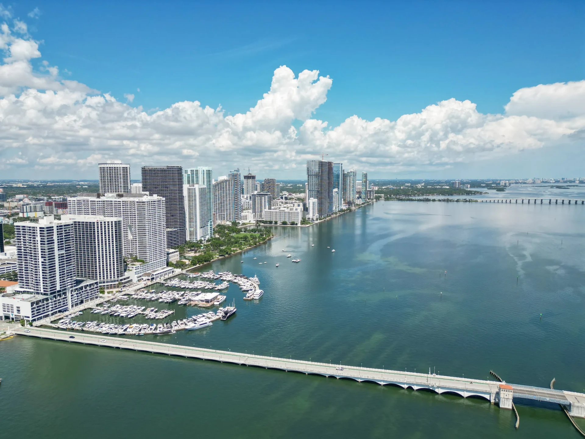 Aerial drone photo of Miami's Edgewater waterfront, marina, and skyline along Biscayne Bay